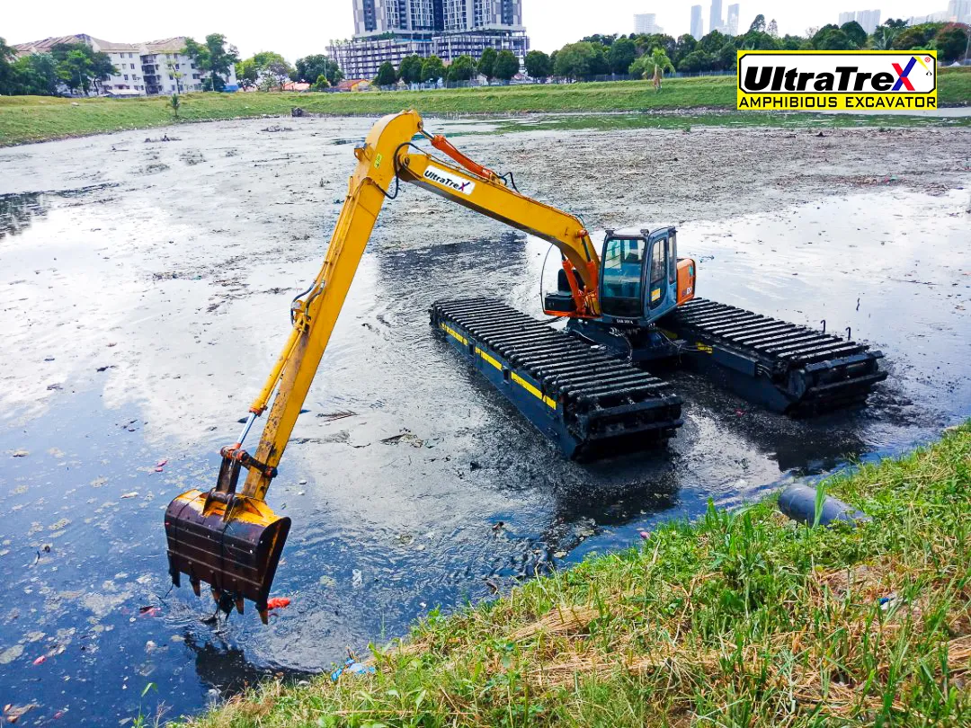 Ultratrex Amphibious Undercarriage AT120ER-V2 mounted on Hitachi EX-120 excavator used for lake restoration at city area.